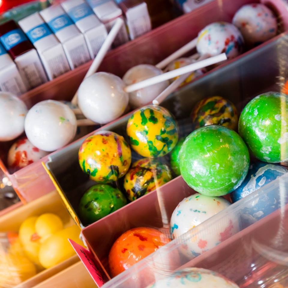 Bins of jawbreakers and lollipops in the candy display